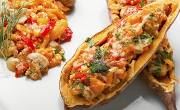 Baked sweet potatoes with peppers,quinoa and mushrooms.Vegetarian food